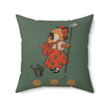 Green pillow with a vintage-style illustration of a girl in a red dress and bonnet holding a flower and a watering can.